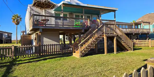 Image 3: Bbeach house with a spacious deck, wooden and fenc