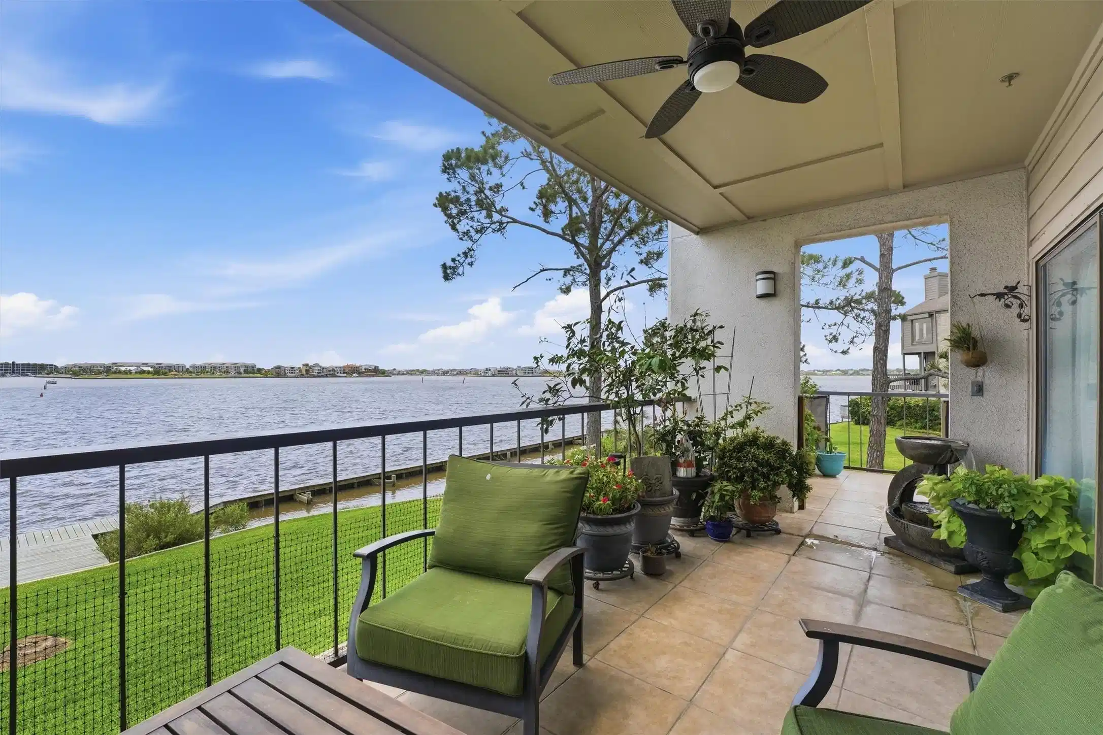 Image 1: One of the few coveted wraparound waterfront patio