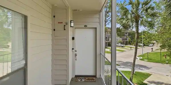 Image 3: Welcoming private entry tucked into this desirable