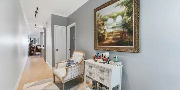 Image 4: Bright, inviting entry hallway sets the tone for t