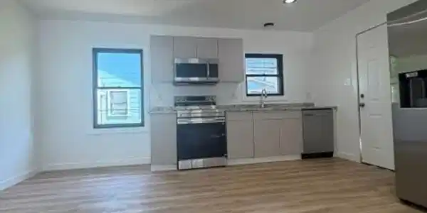 Image 4: This photo showcases a modern kitchen with stainle