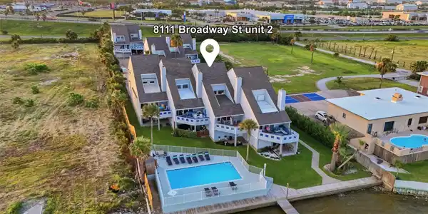 Image 3: Oasis Townhomes offers a peaceful bayfront setting