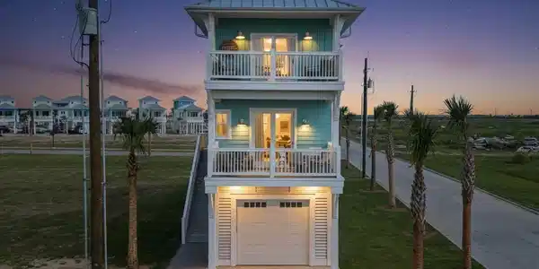 Image 2: Front exterior at dusk showcasing coastal architec