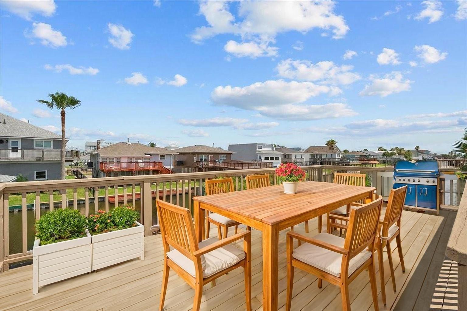 Image 4: Virtually staged deck overlooking the canal