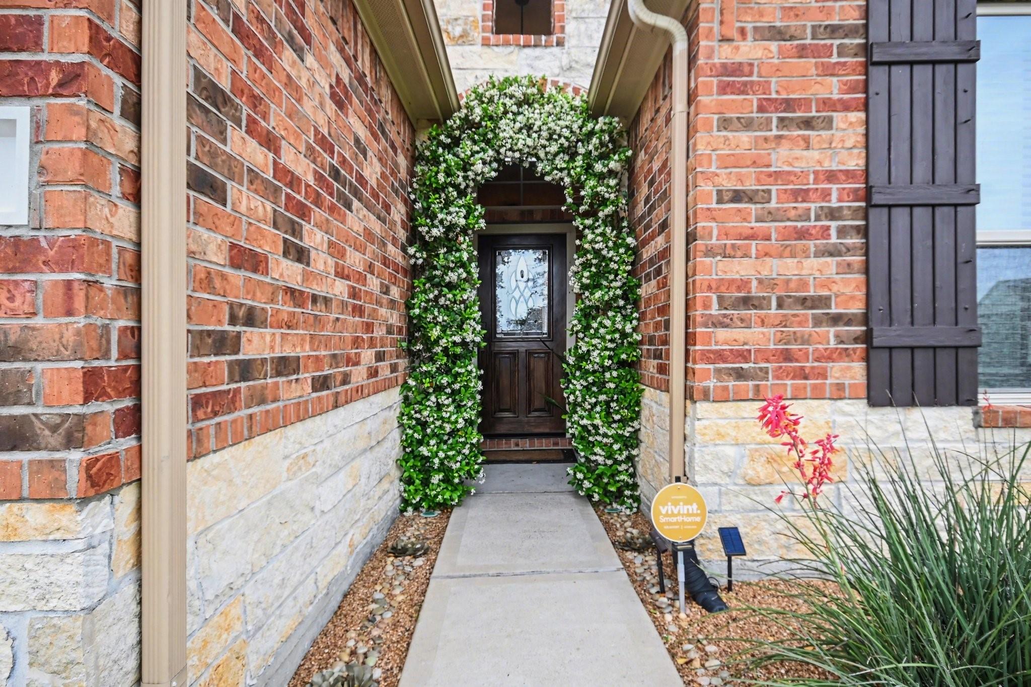 Image 4: Charming entrance with a brick exterior, elegant a