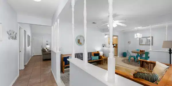 Image 3: Open, connected living and dining spaces offer a c
