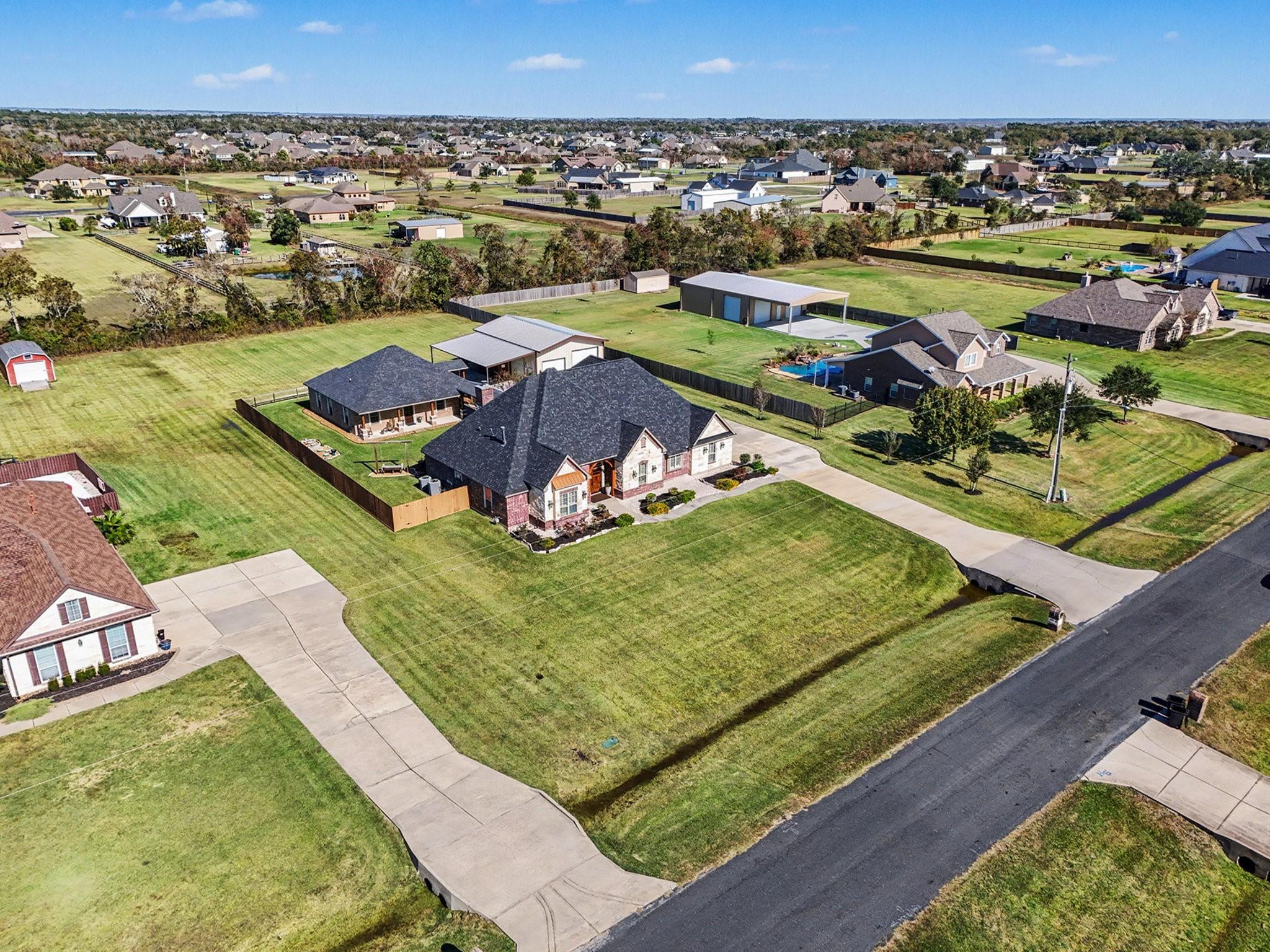 Image 4: Ariel view of main house, guest house, shop with a