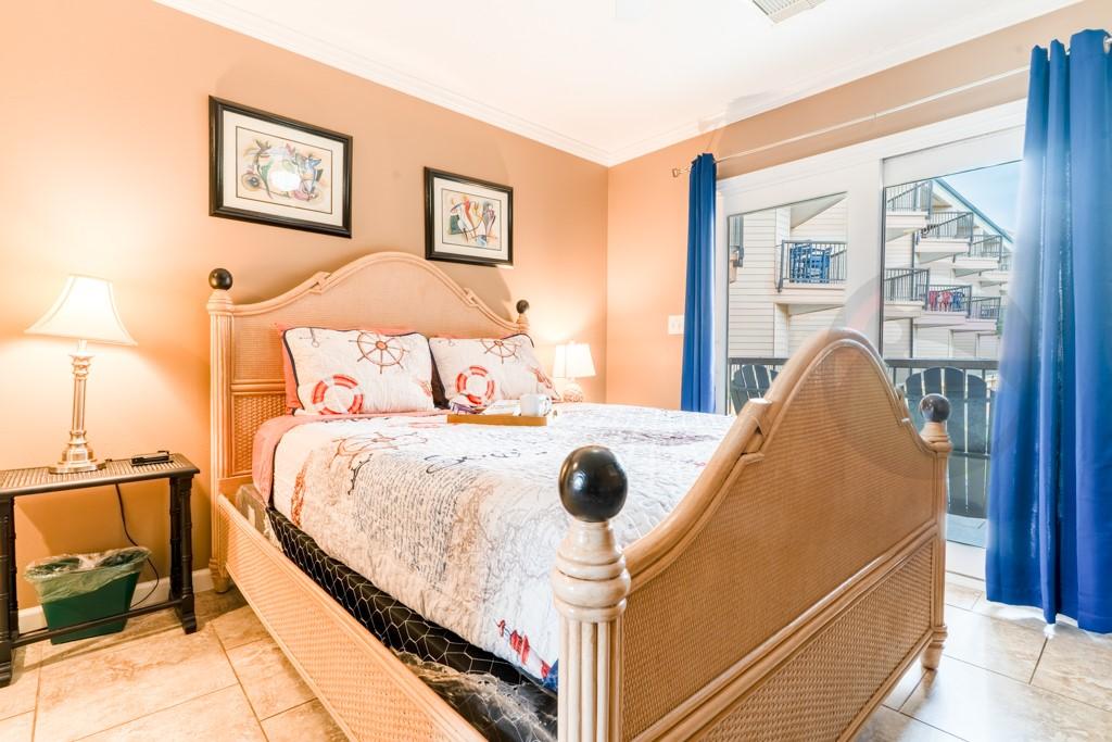 Image 4: Primary Bedroom with queen bed