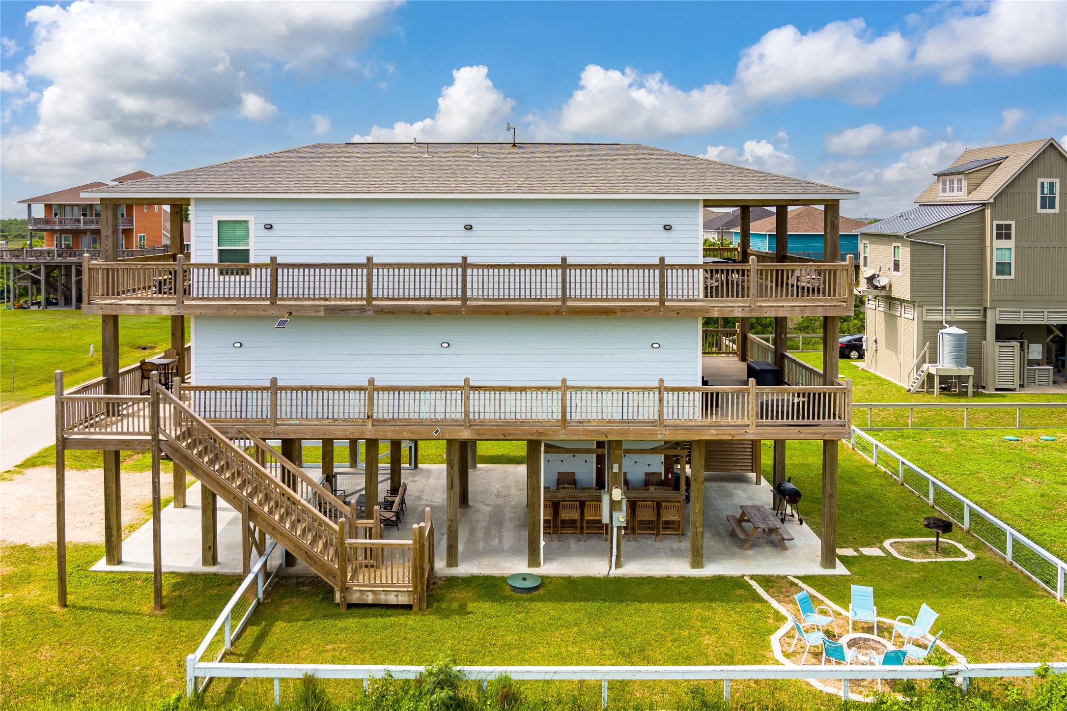 Image 2: The ground floor is vacation-ready with tiki bar,
