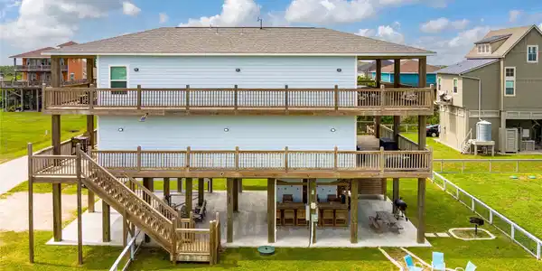Image 2: The ground floor is vacation-ready with tiki bar,