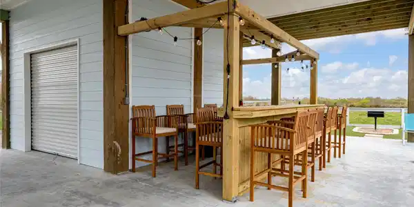Image 4: The tiki bar is strung with lights and is ready fo