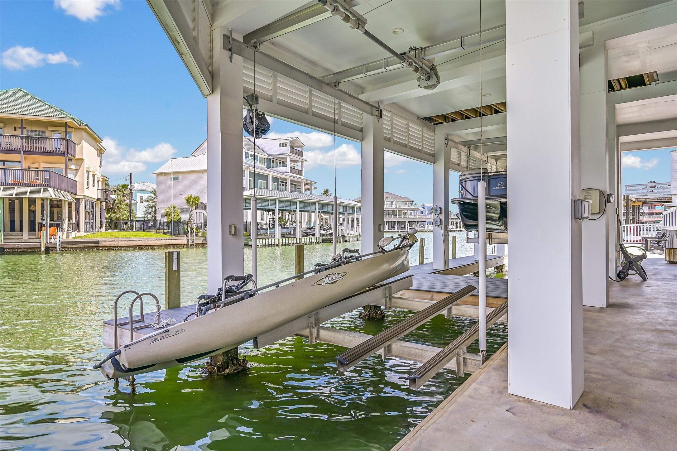 Image 4: The covered waterfront level delivers seamless acc