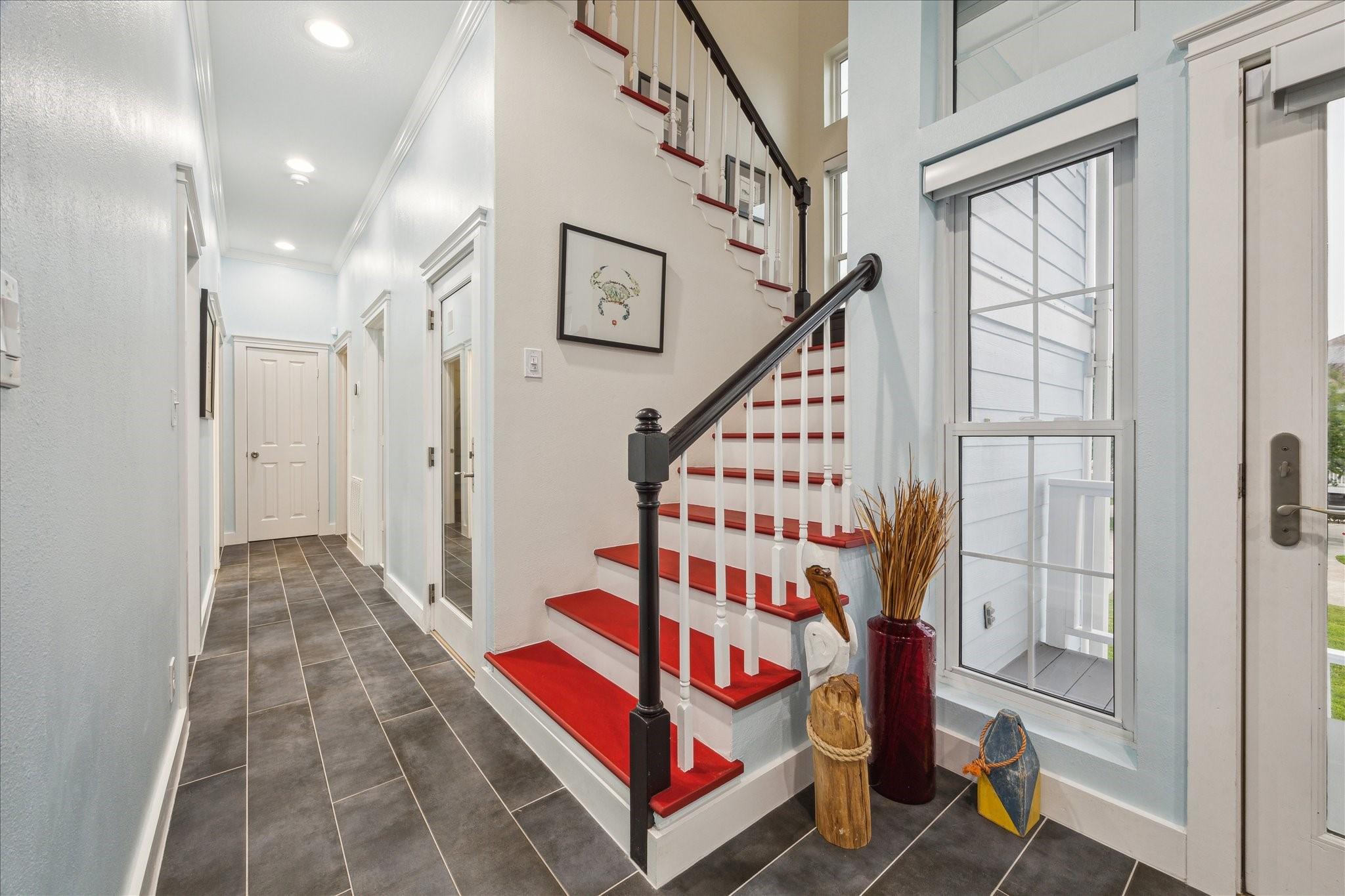 Image 4: Bright and inviting entryway with modern tile floo