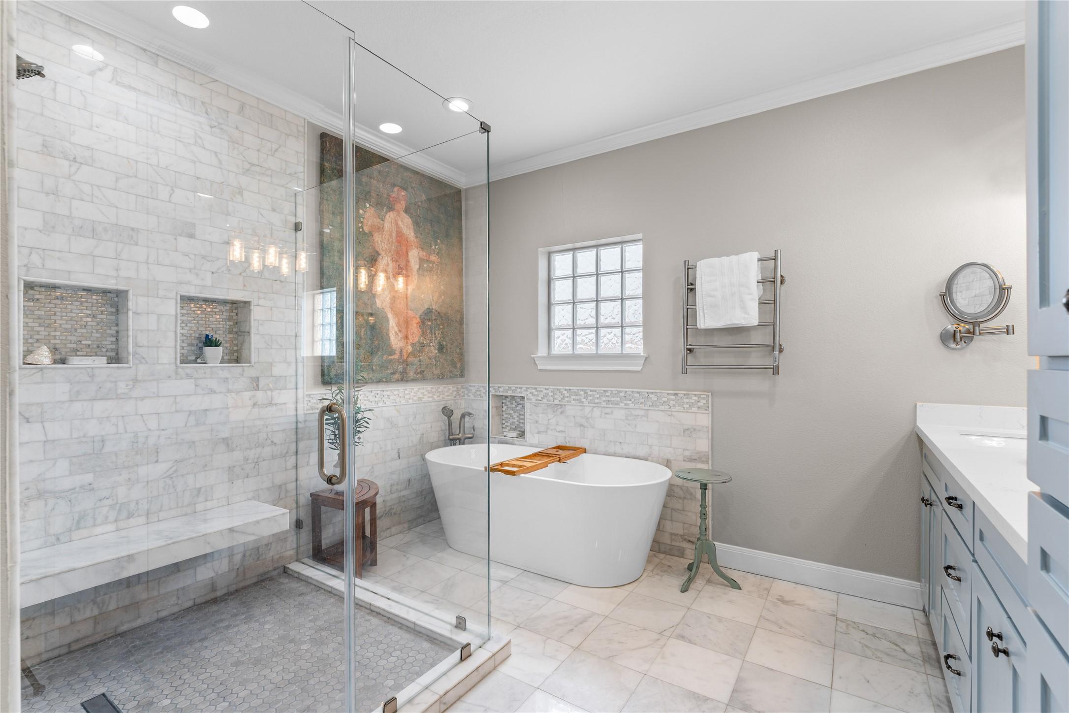Image 1: Luxury primary bathroom with heated marble floors,