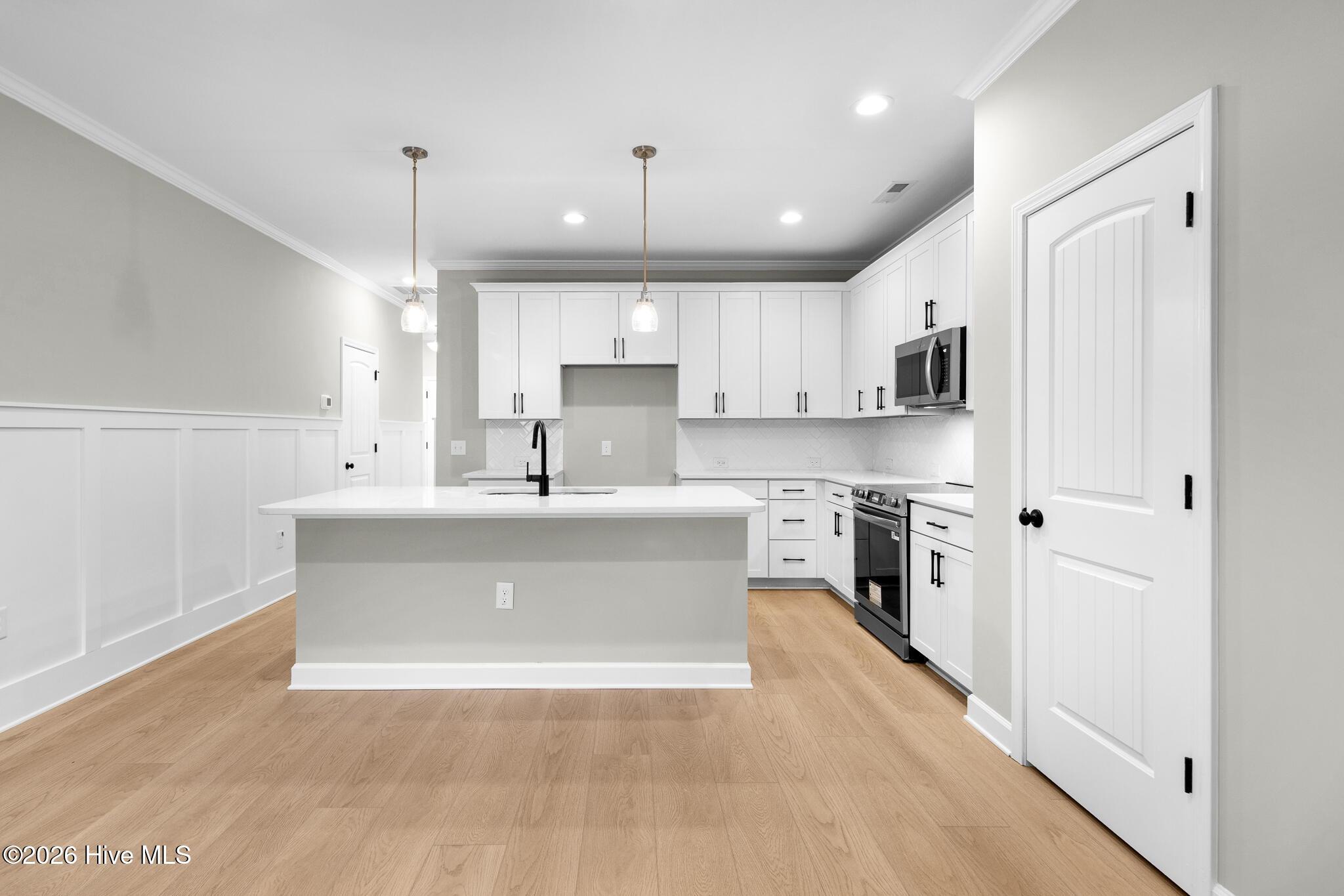 Image 3: Open Concept Kitchen and Living