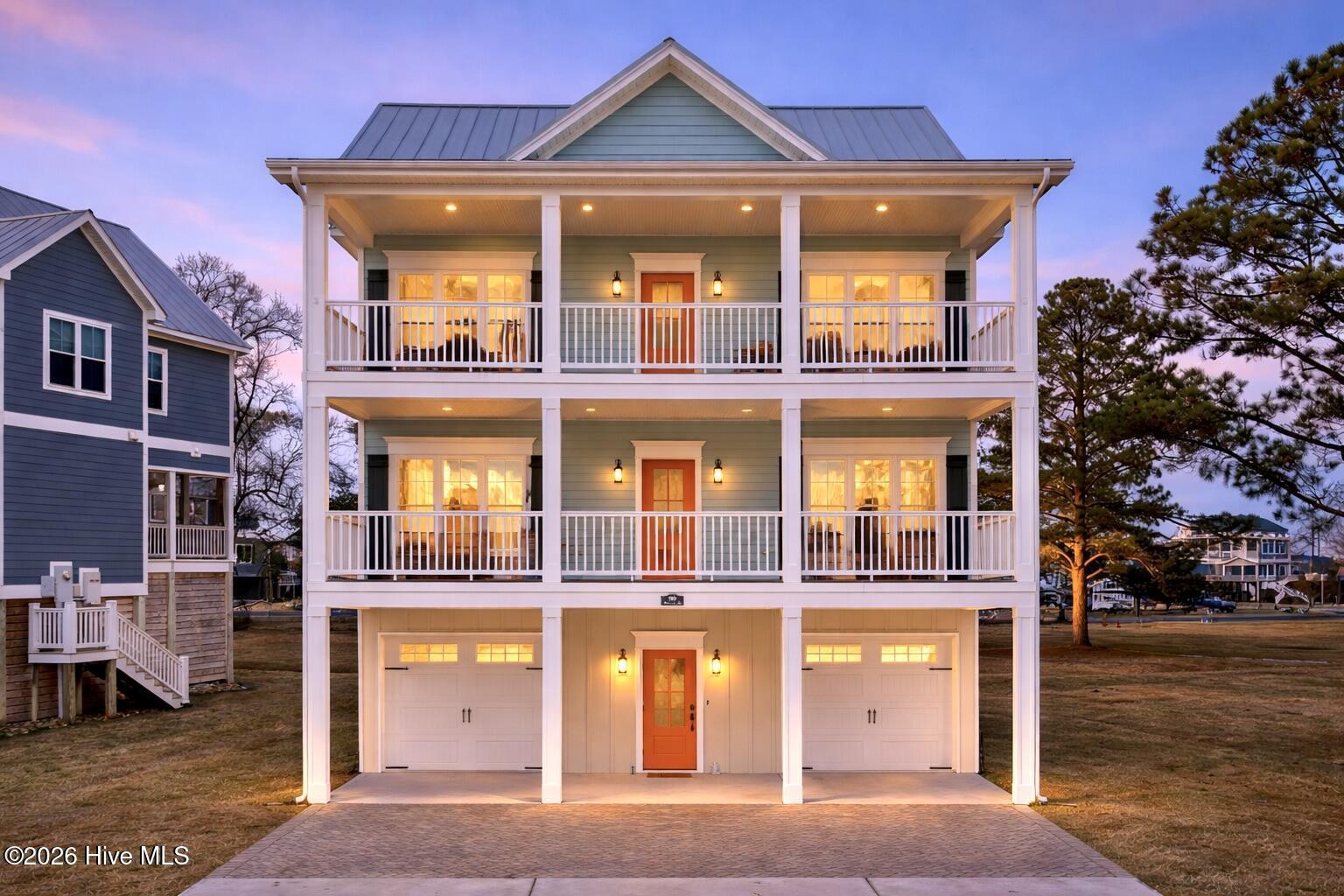 Image 1: Coastal beach house at twilight