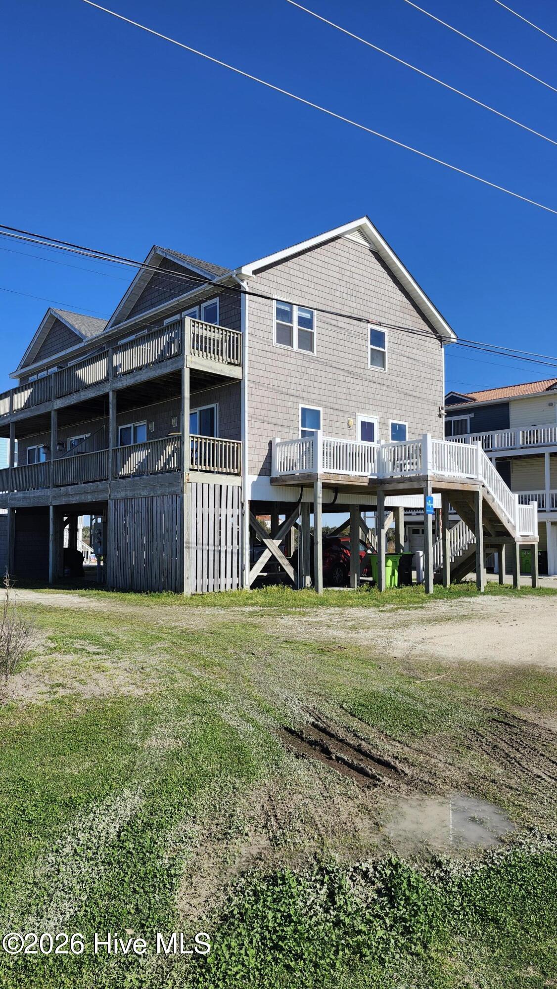 Image 1: Front of house with stairs to front door