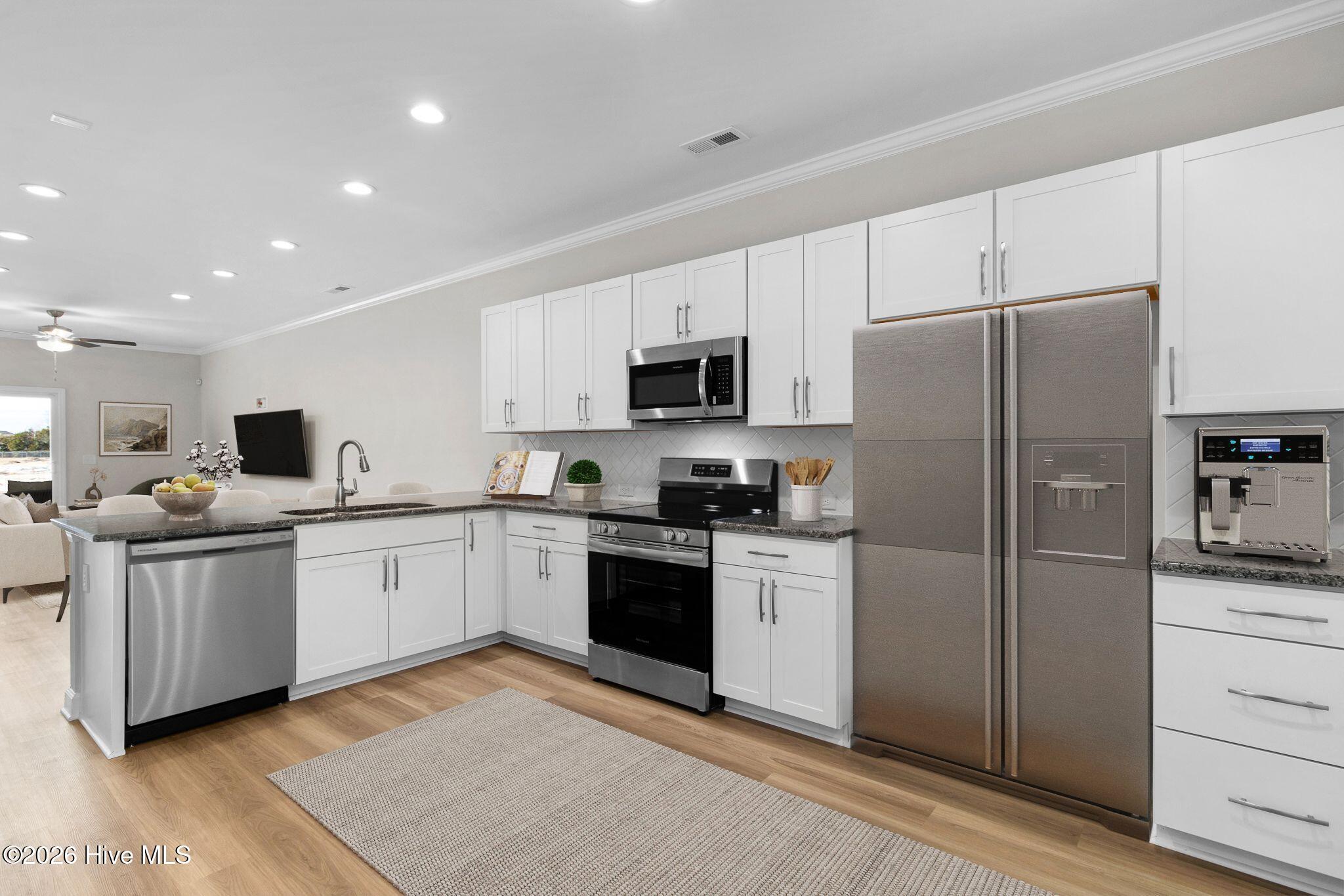 Image 4: Open Concept Kitchen and Living