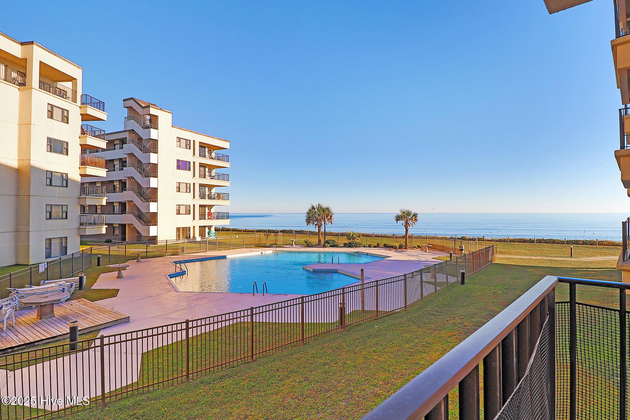 Image 2: Ocean & pool views from covered porch