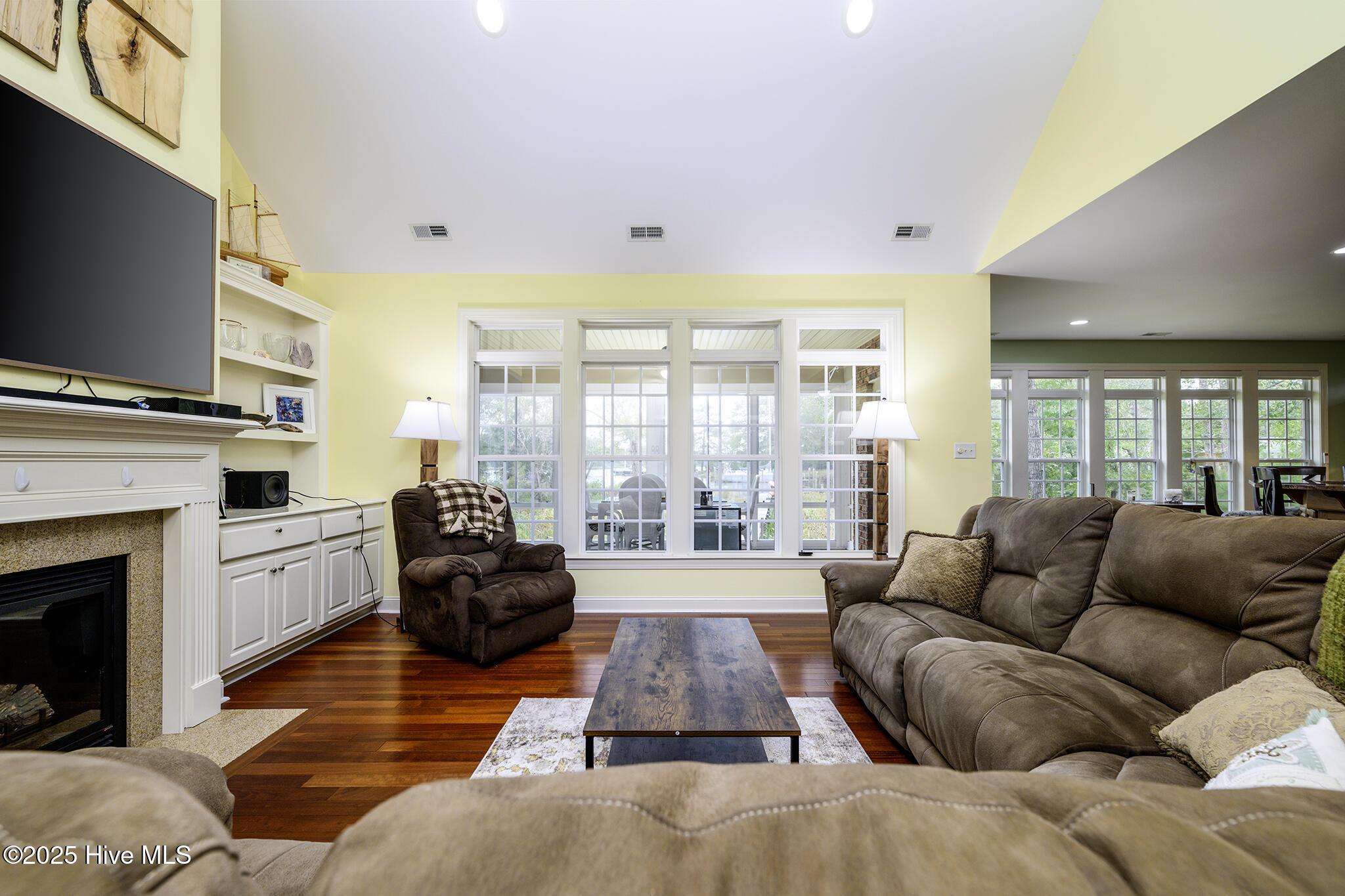 Image 3: Living Room with Vaulted Ceiling