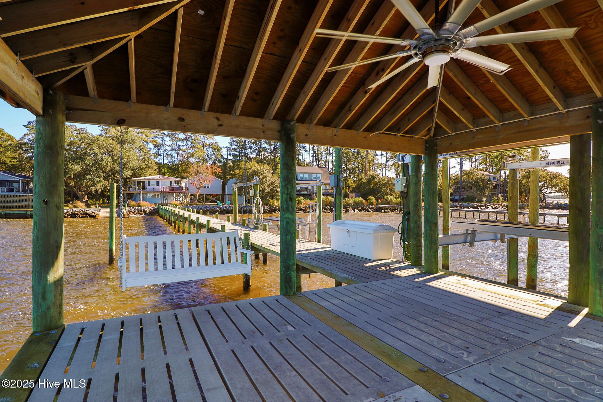 Image 4: Covered dock area with swing