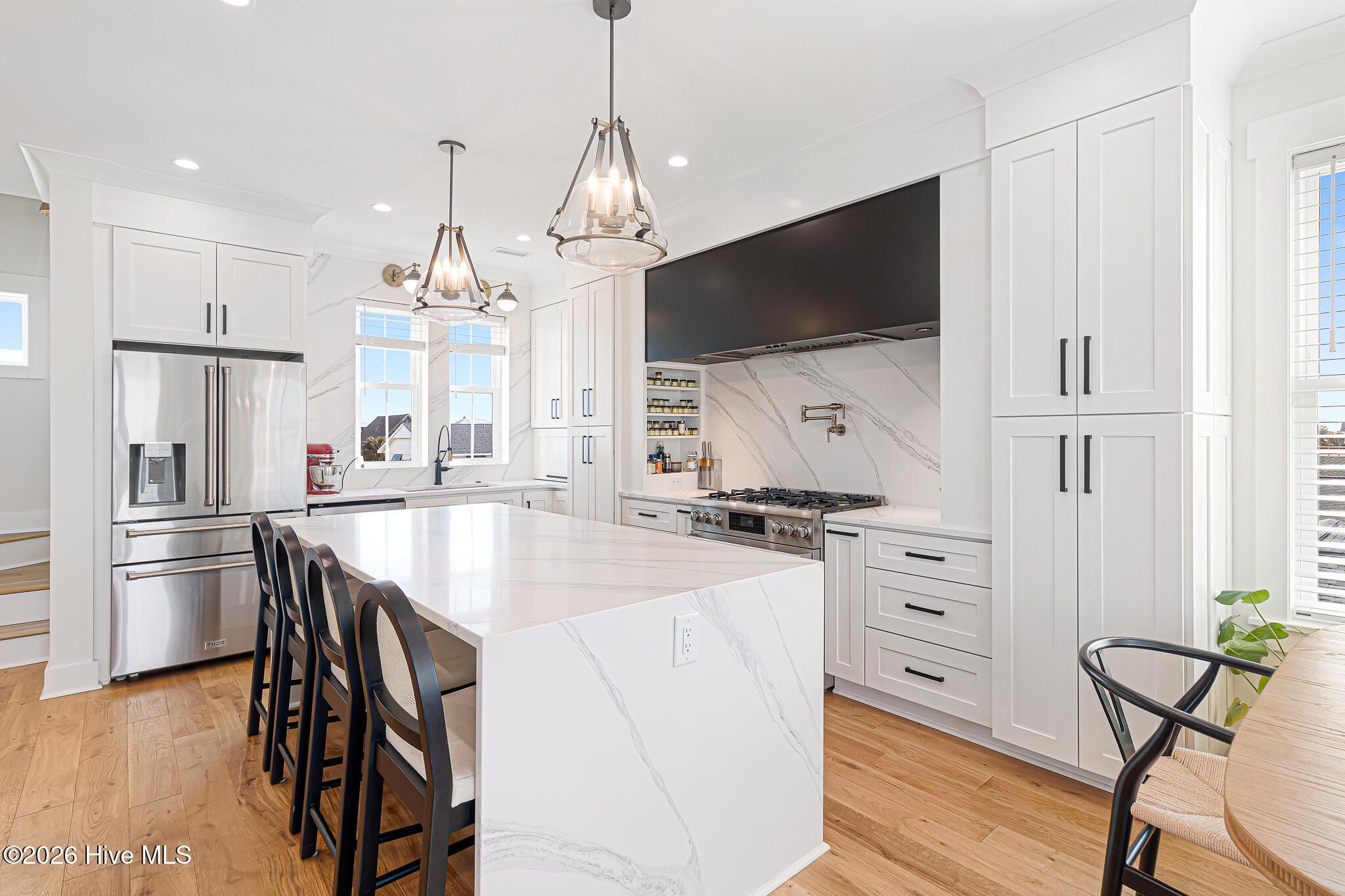 Image 2: Kitchen with Island and Upgrades