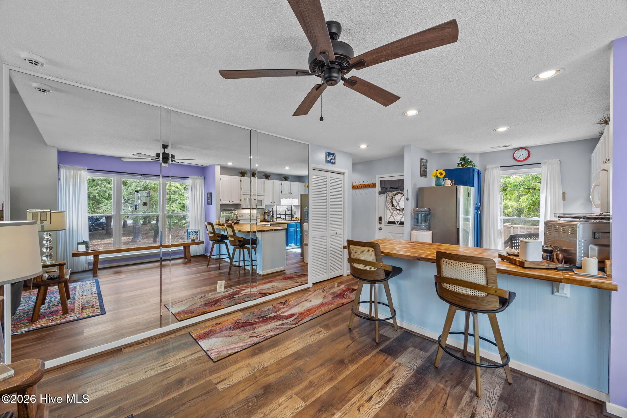Image 4: Living area looking towards entryway