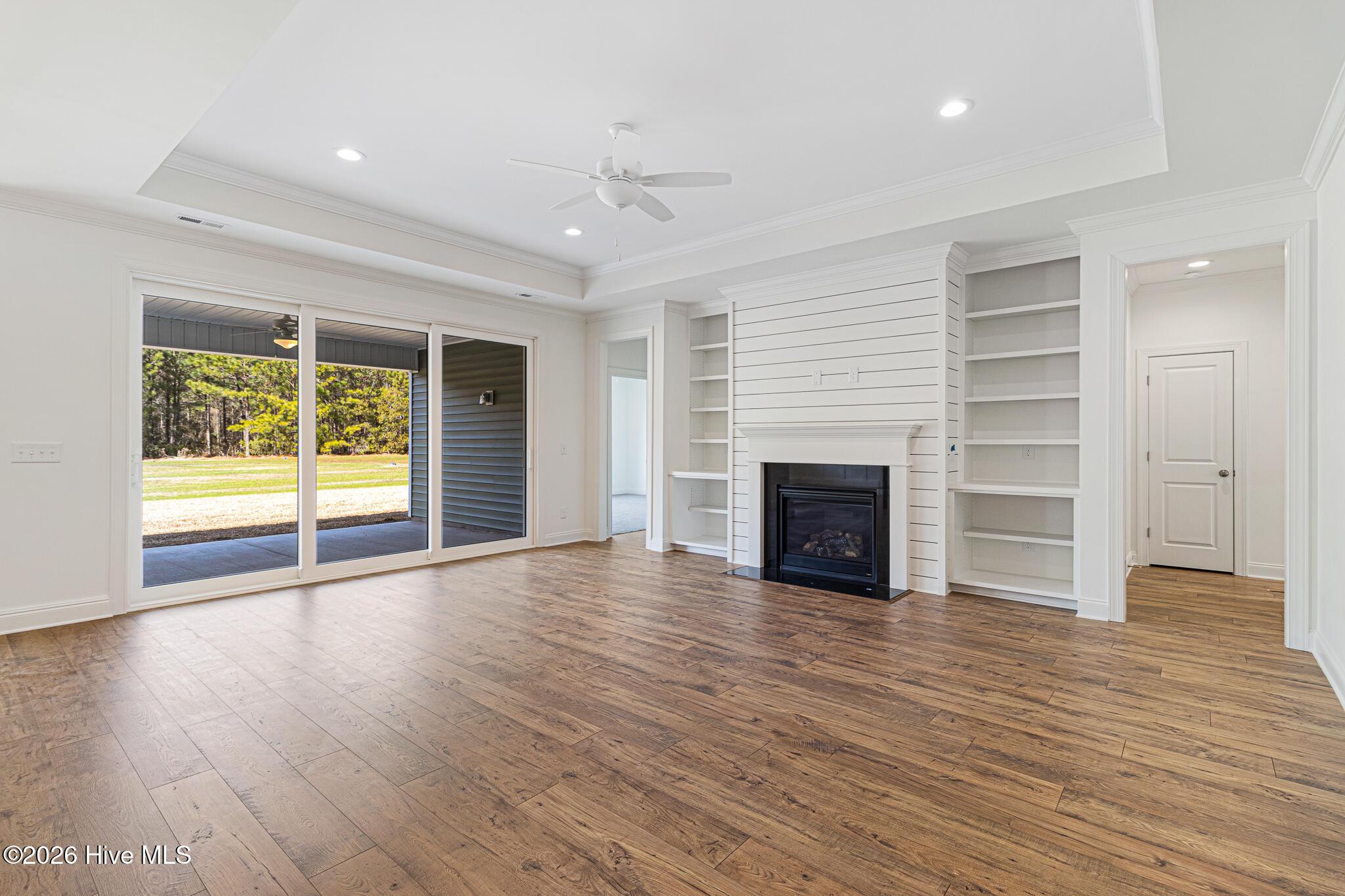 Image 4: Large Open Living Room with Fireplace