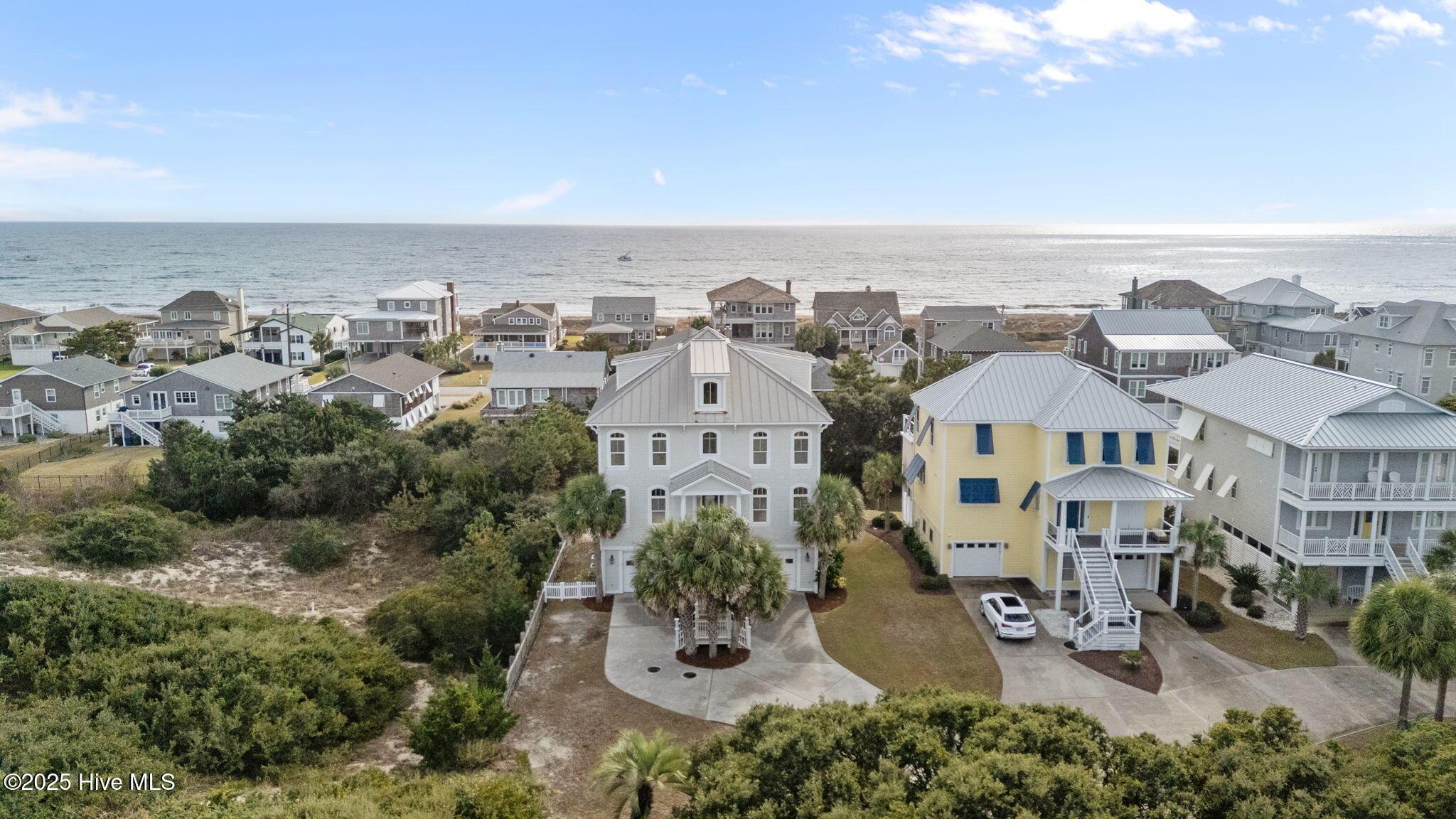 Image 1: Drone view of home and ocean