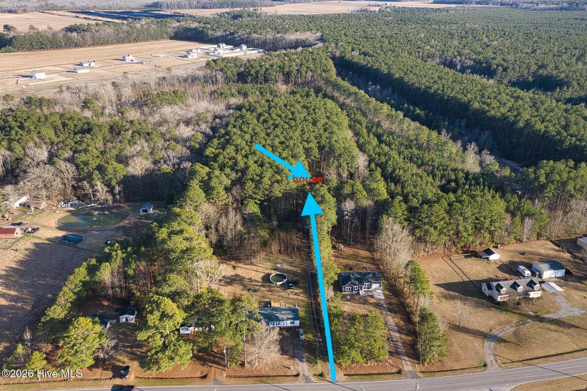 Image 2: aerial house and driveway with acreage