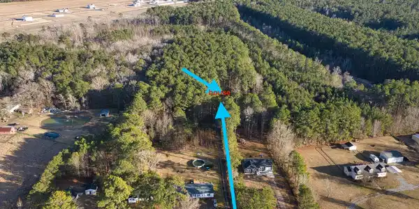 Image 2: aerial house and driveway with acreage