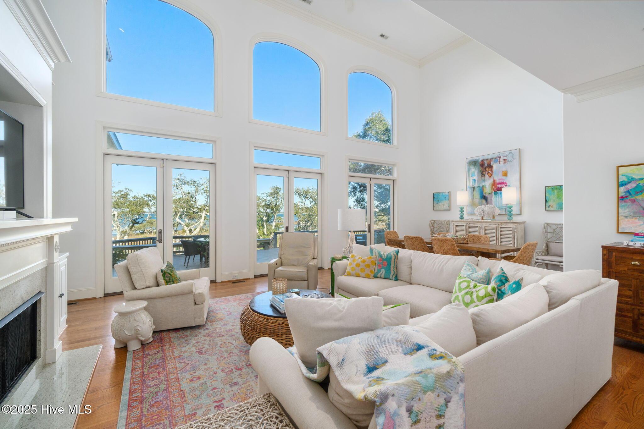 Image 4: Open LR w/ fireplace & cathedral ceiling