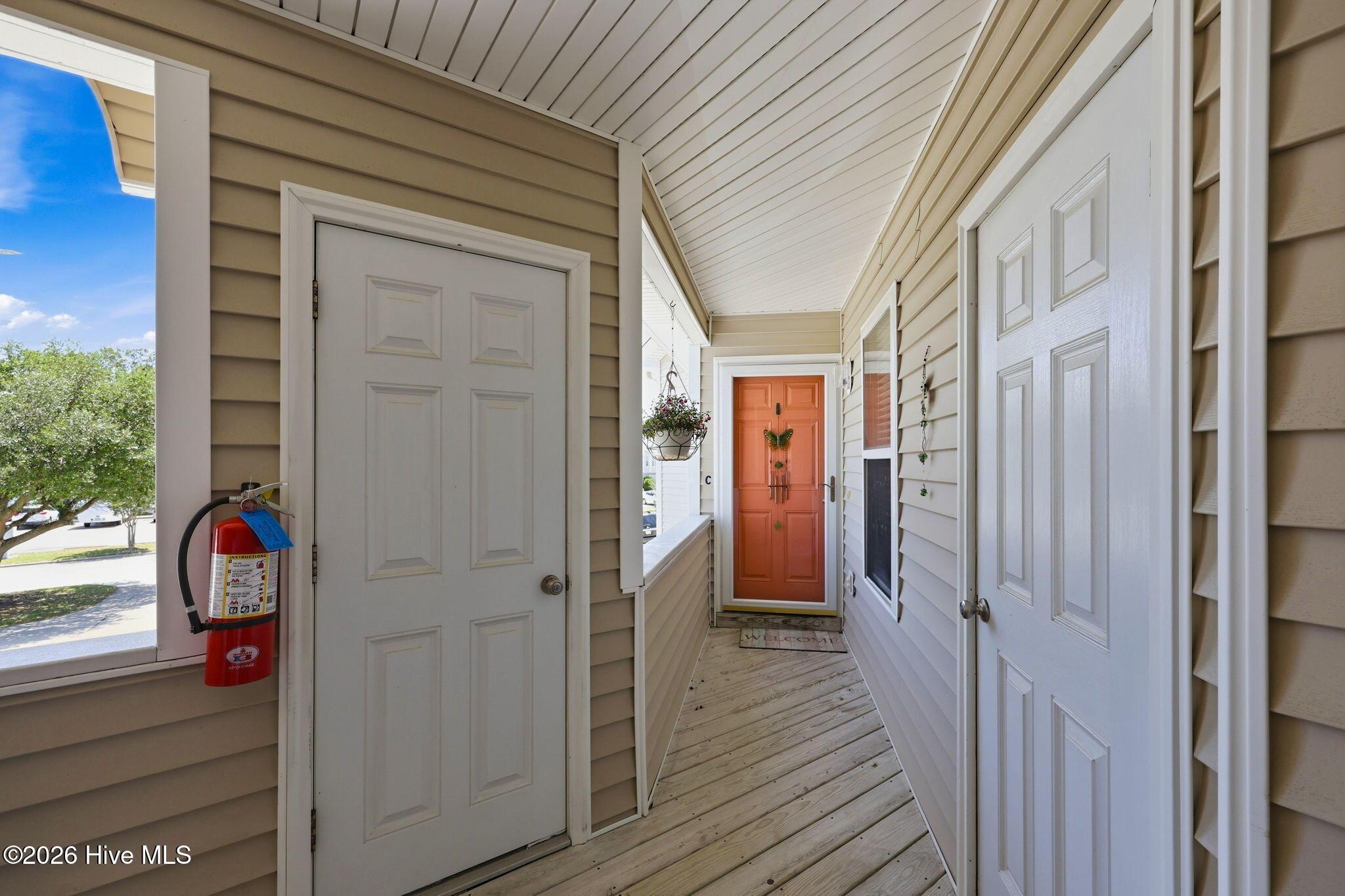 Image 2: Front entrance with two storage rooms