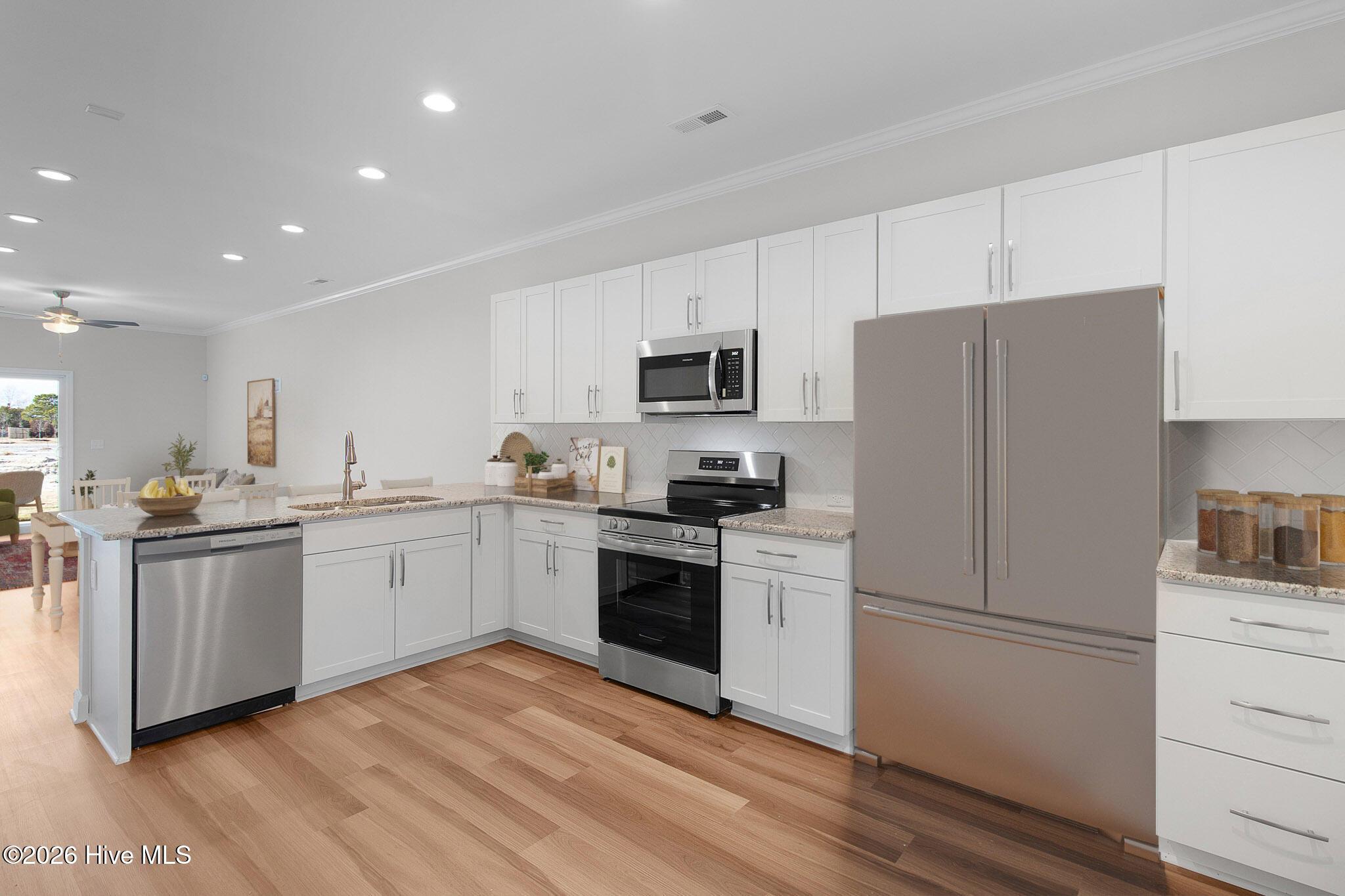 Image 2: Open Concept Kitchen and Living