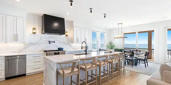 Image 2: Main Kitchen Open to Dining and Living A