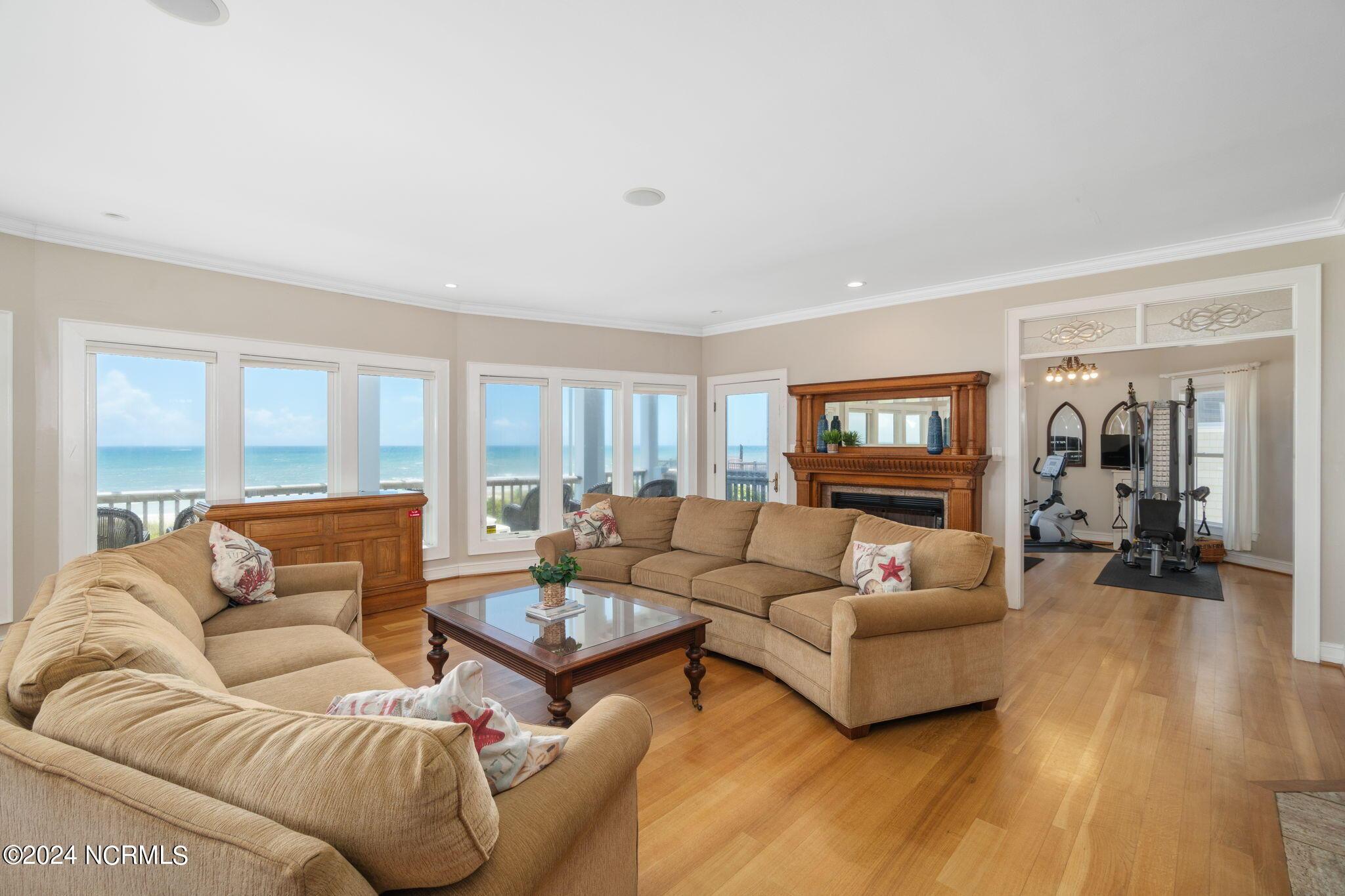 Image 4: Open living room w/ fireplace