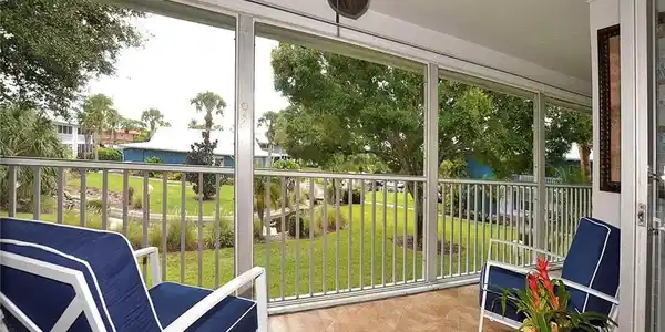 Image 2: This oversized screened lanai truly feels like an