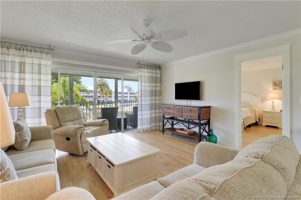 Image 3: Spacious light-filled living area with luxury viny