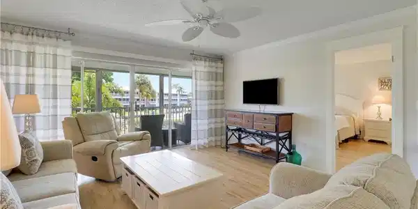 Image 3: Spacious light-filled living area with luxury viny