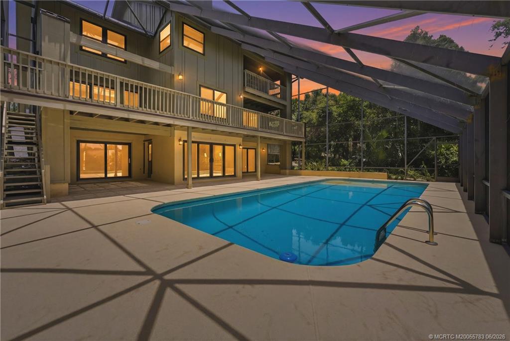 Image 2: Fully screened patio and 40' X 17' pool