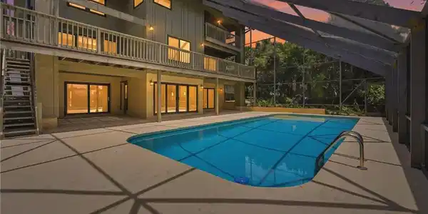 Image 2: Fully screened patio and 40' X 17' pool