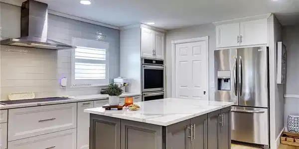 Image 2: Kitchen toward pantry door closed