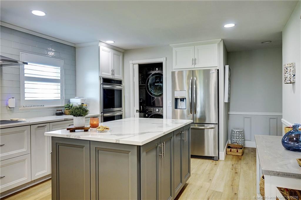 Image 3: Kitchen toward washer/dryer on left
