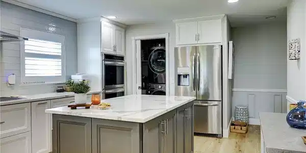 Image 3: Kitchen toward washer/dryer on left