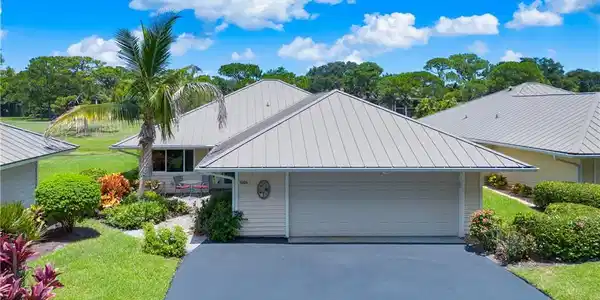 Image 2: front with 1 1/2 car garage (car+golf cart)