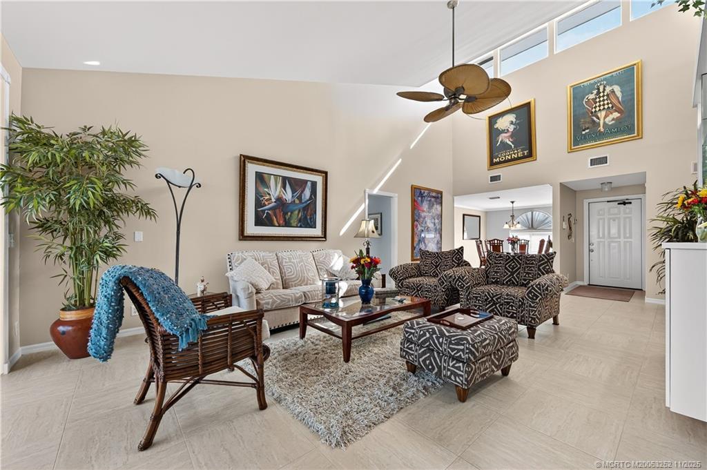 Image 1: Living Room with high vaulted ceilings.