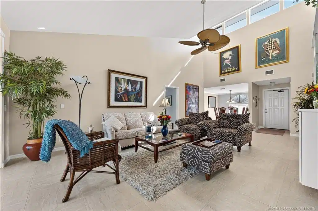 Image 1: Living Room with high vaulted ceilings.