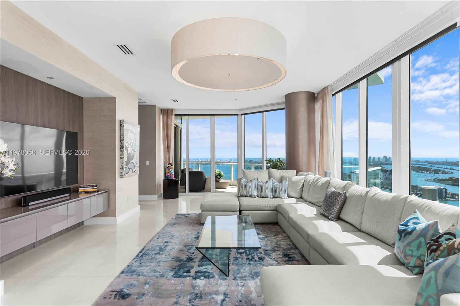 Image 2: Expansive living room with panoramic bay views