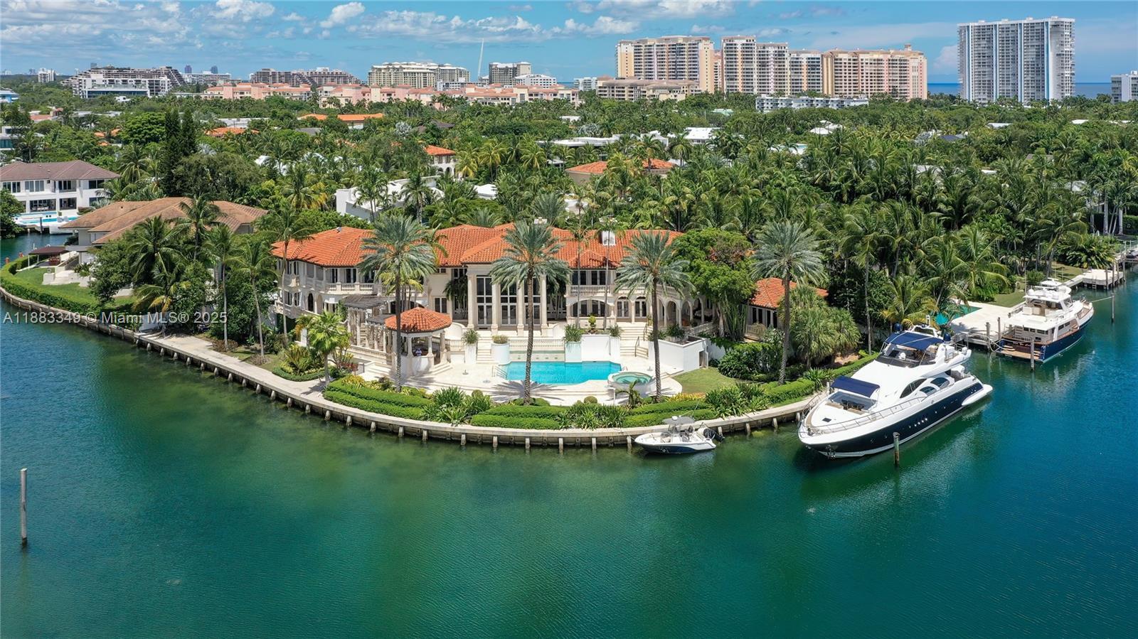 Image 1: To the right of the house is a 98-foot yacht.  The vast views of the water are not blocked.