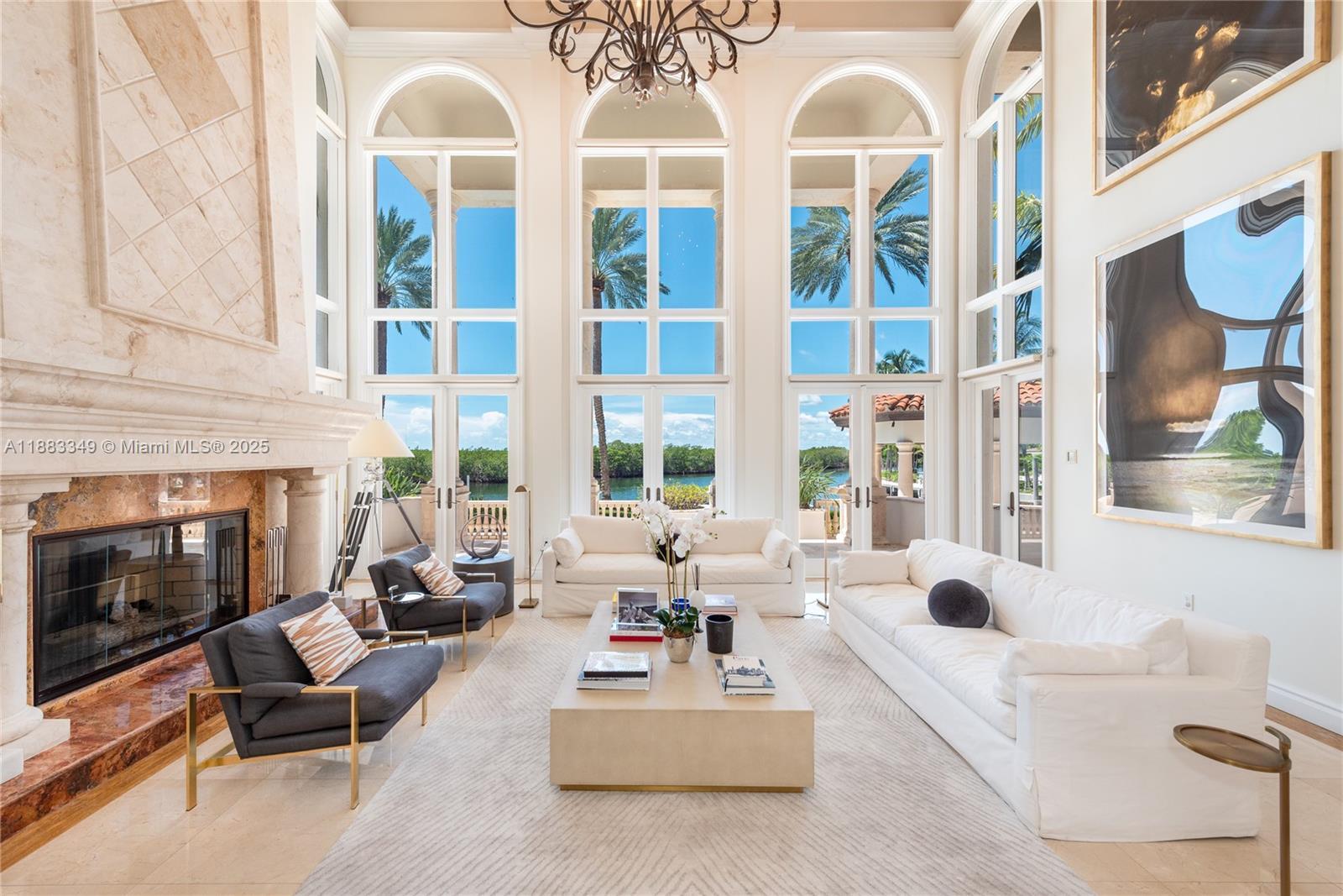 Image 4: Soaring ceilings and a working fireplace make this room very special.